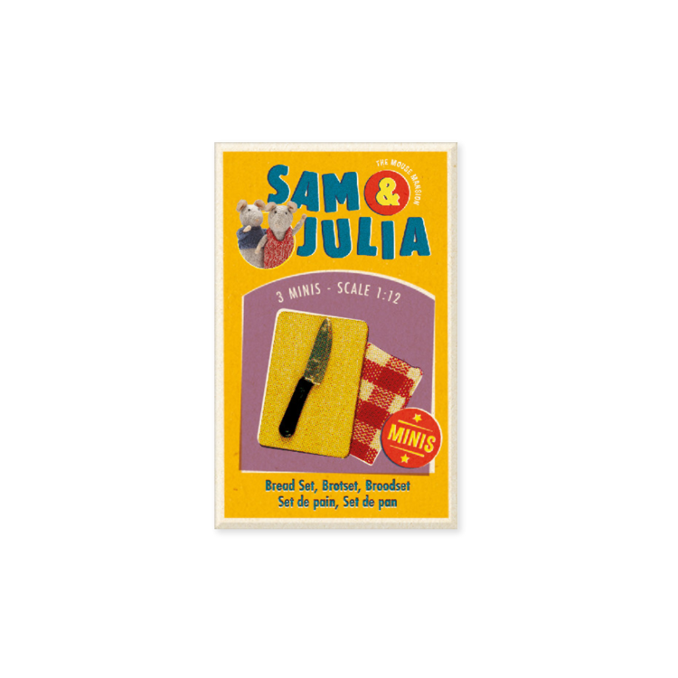Packaging of Sam & Julia miniatures with bread, knife, and towel on a yellow background